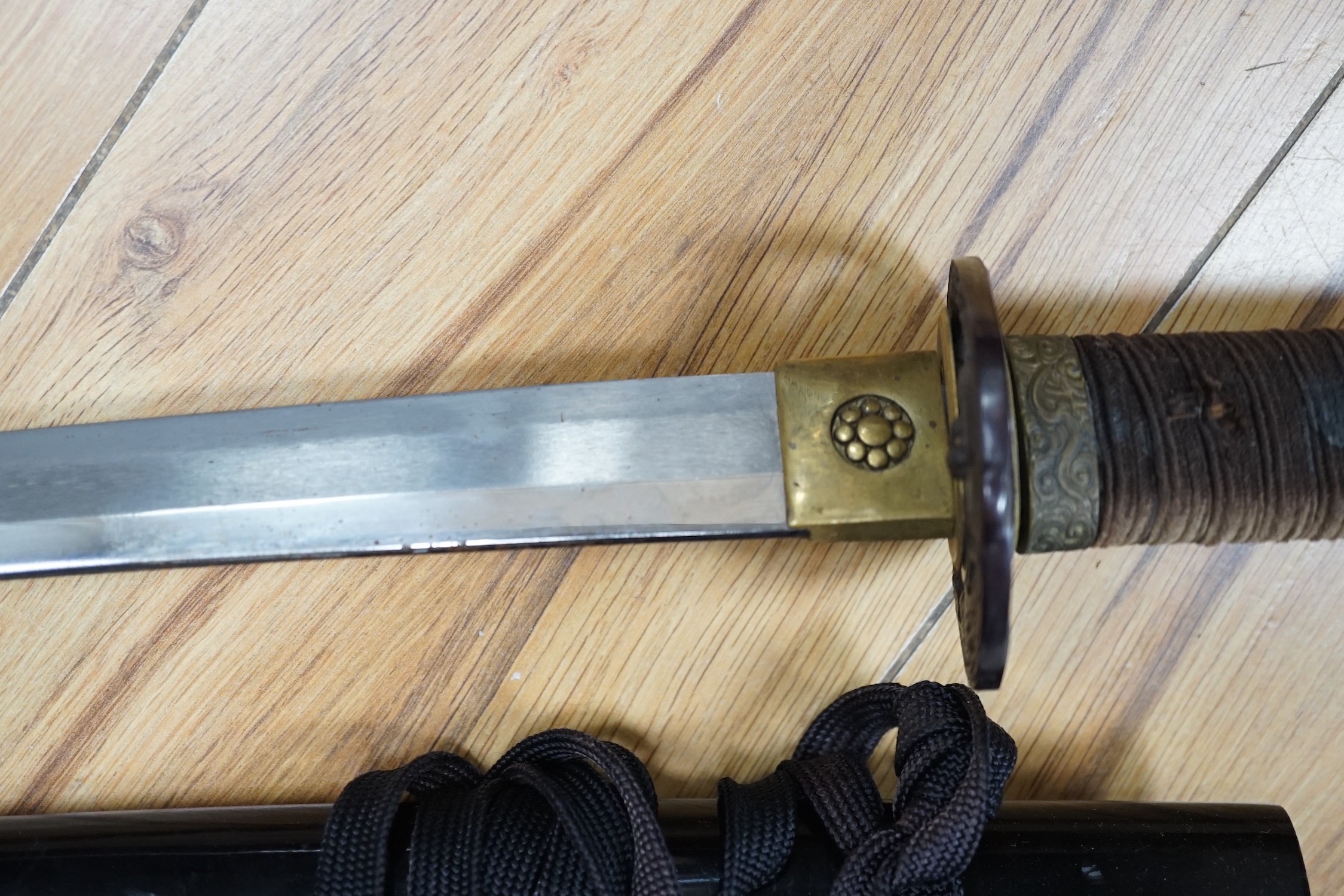 A 20th century Japanese wakizashi with cast iron ‘tiger’ tsuba, total length 73cm including scabbard